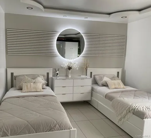 a bathroom with a sink double vanity and a shower