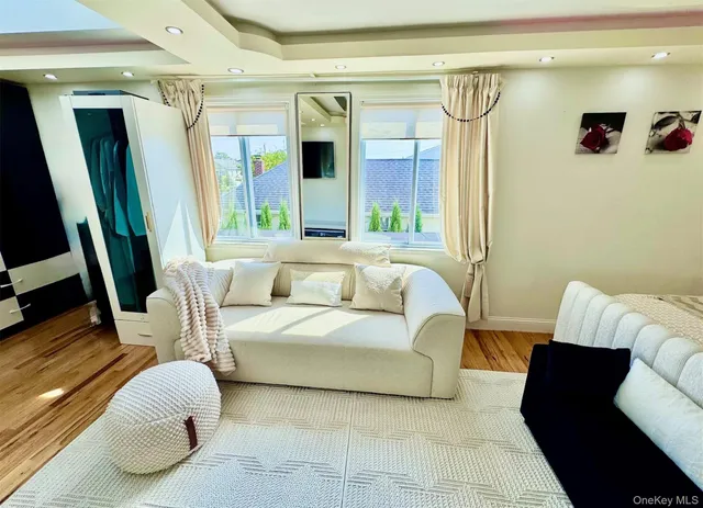 a bathroom with a toilet a sink and a mirror