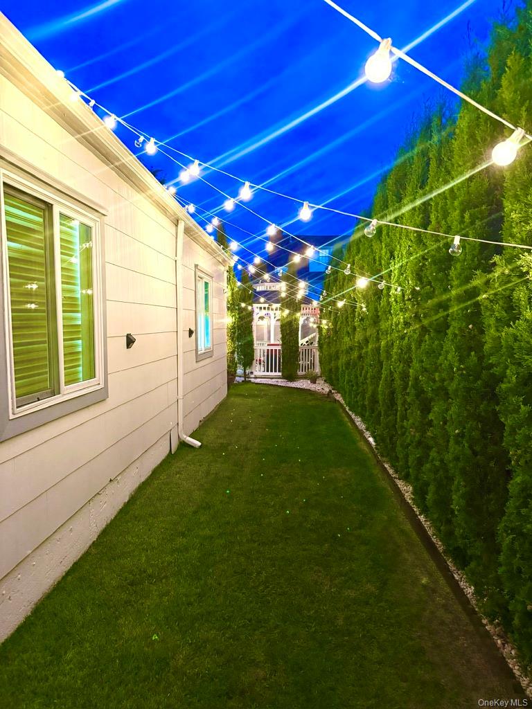 62 Walnut Road Inwood, NY 11096 - Photo 30 of 31 a view of a backyard with a garden