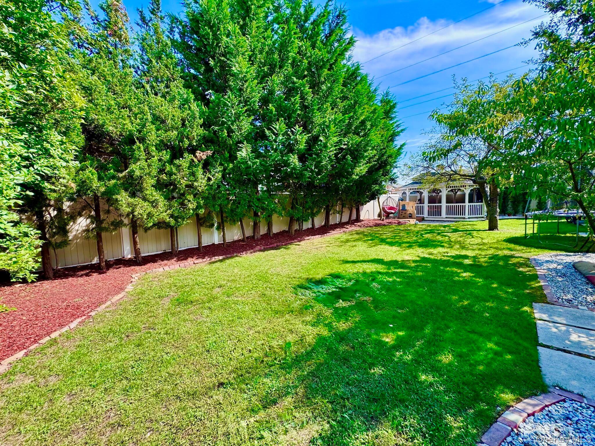 62 Walnut Road Inwood, NY 11096 - Photo 3 of 31 a view of a house with a big yard