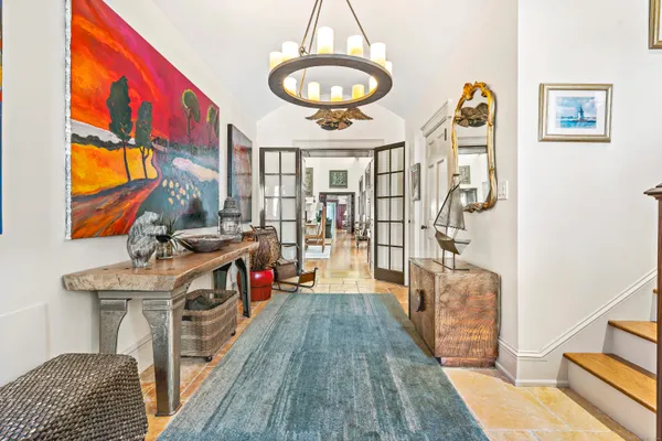a view of a bedroom with furniture and hardwood floor