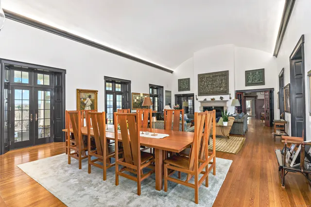 a dining room with furniture and wooden floor