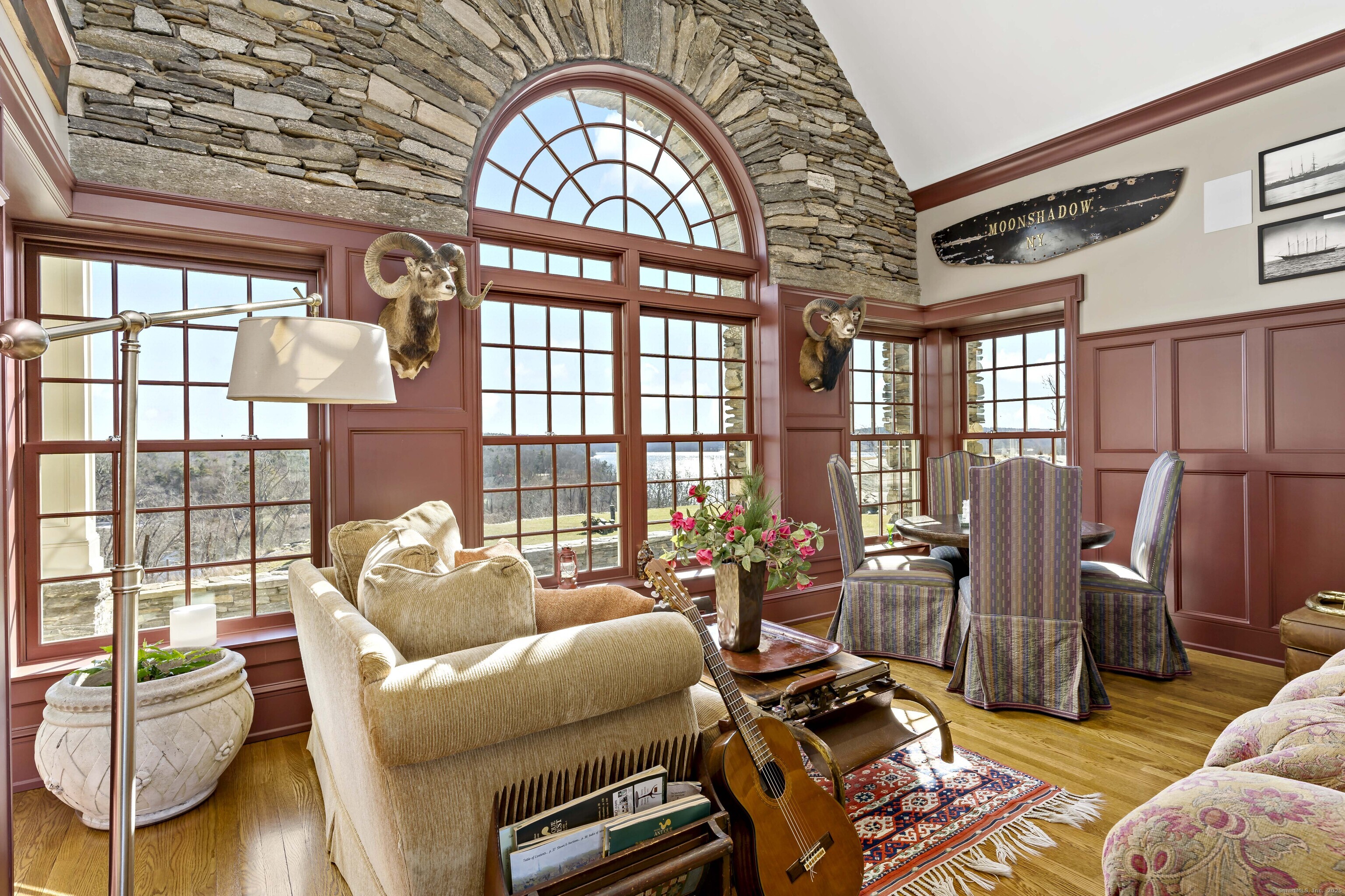 153 Ferry Road Lyme, CT 06371 - Photo 17 of 32 a living room with furniture and a floor to ceiling window