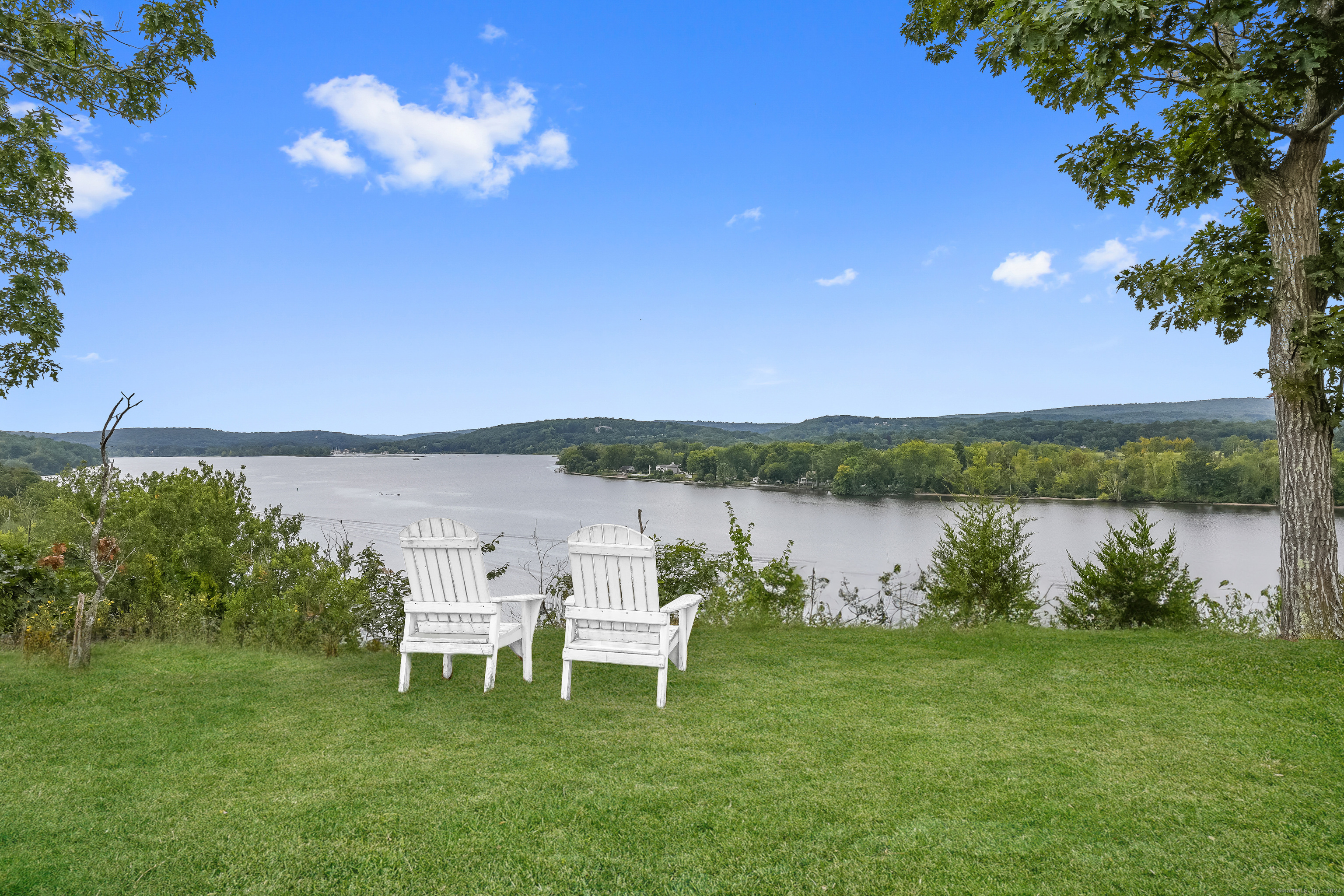 153 Ferry Road Lyme, CT 06371 - Photo 18 of 32 a view of a lake with outdoor seating