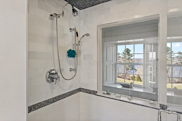 a bathroom with a bath tub and a shower