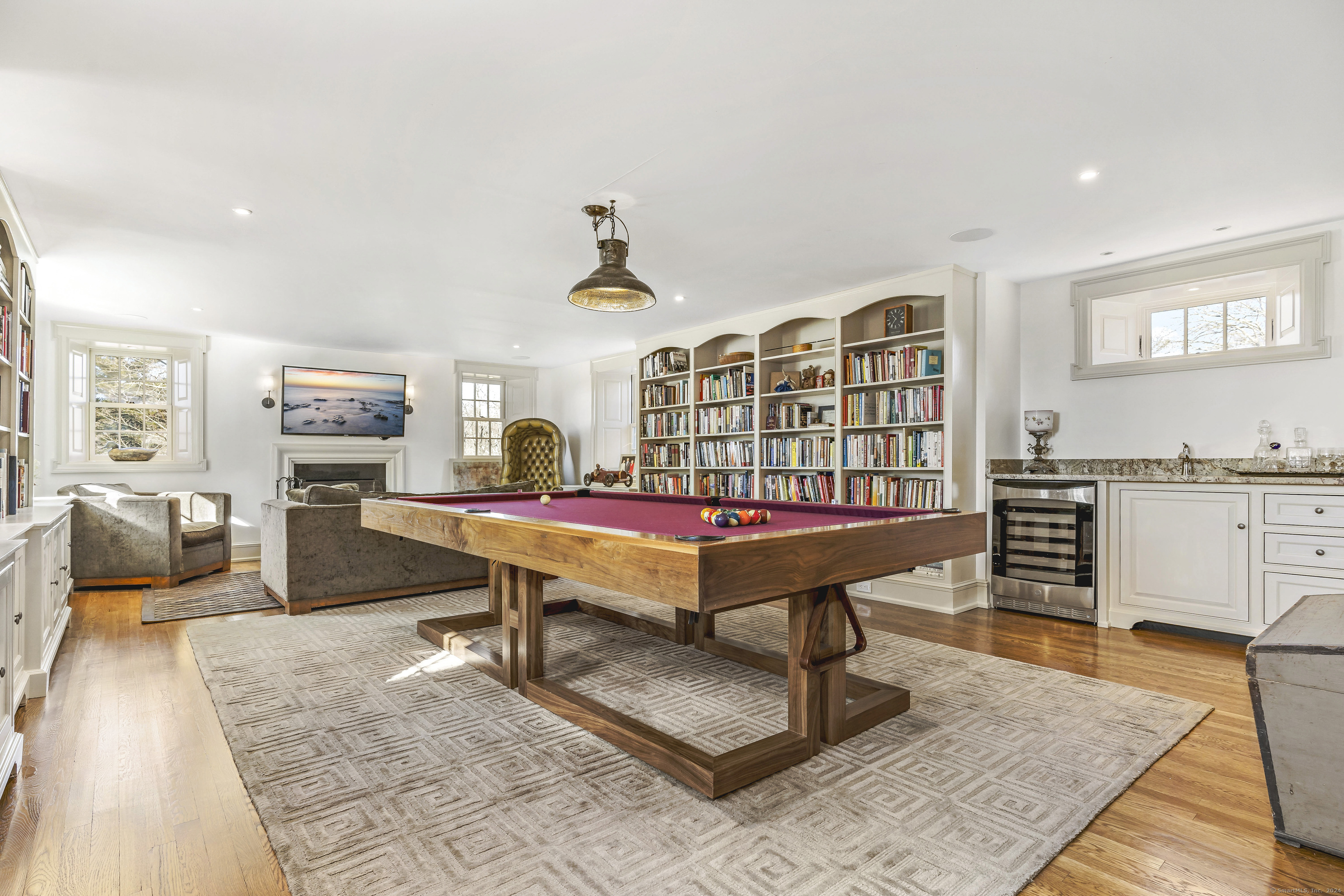 153 Ferry Road Lyme, CT 06371 - Photo 24 of 32 a living room with furniture a flat screen tv and pool table