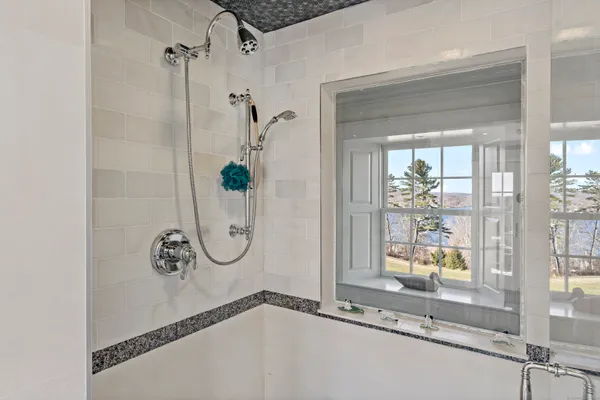 a bathroom with a bath tub and a shower