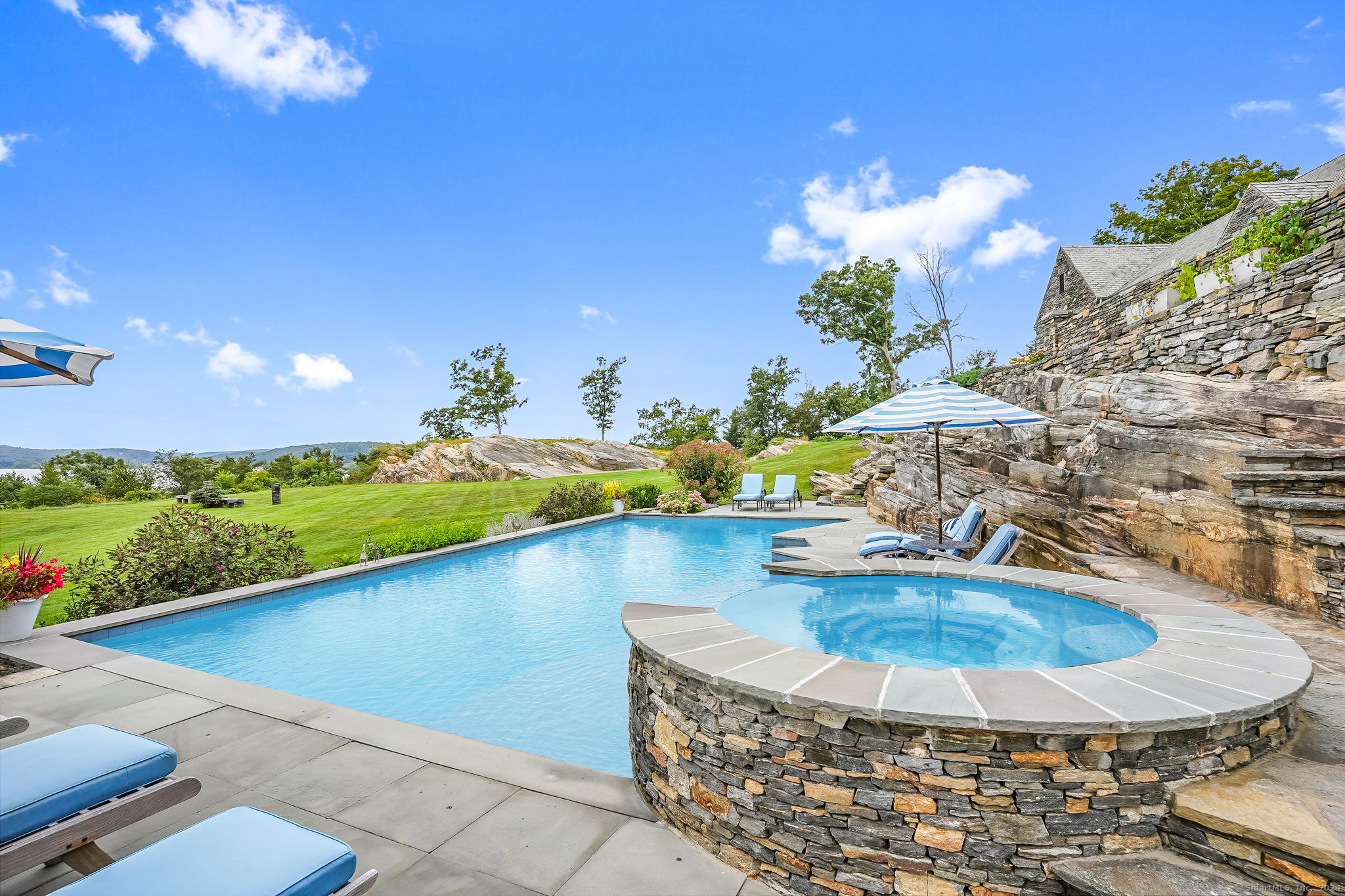 153 Ferry Road Lyme, CT 06371 - Photo 9 of 32 a view of a swimming pool with an outdoor space and seating