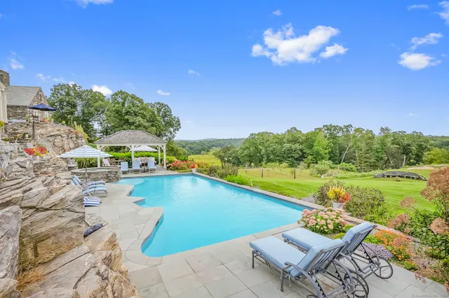 a view of a swimming pool with a lounge chairs