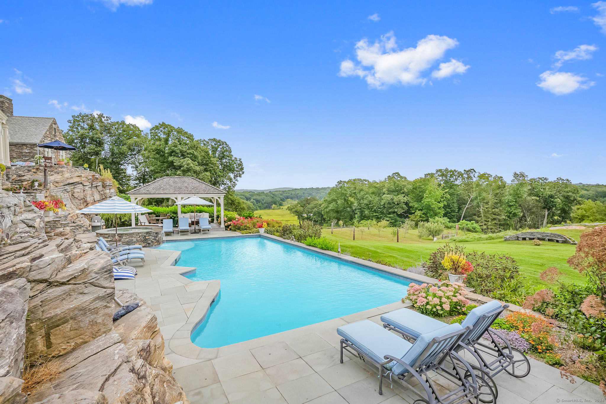 153 Ferry Road Lyme, CT 06371 - Photo 10 of 32 a view of a swimming pool with a lounge chairs