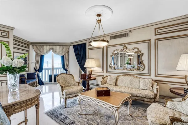 a living room with furniture and a rug