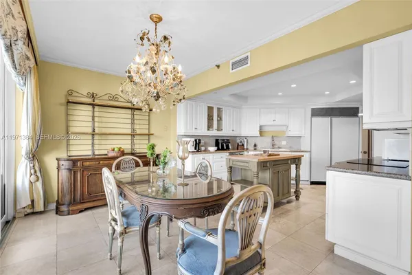 a kitchen with granite countertop a sink and cabinets