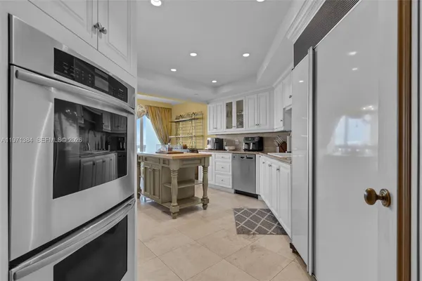 a kitchen that has a sink and a stove