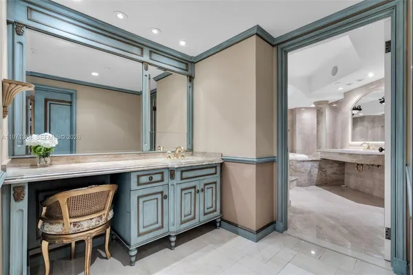 a view of a bathroom with a sink a mirror and a bathtub