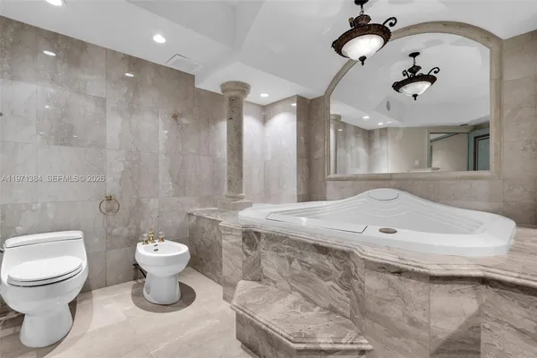 a bathroom with a shower sink and mirror