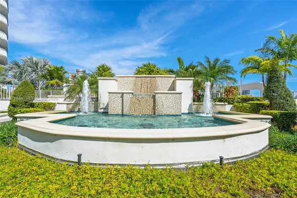 a view of a swimming pool with outdoor seating