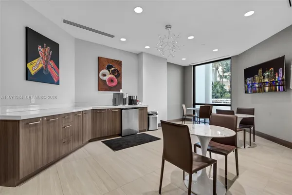 a lobby with furniture and window