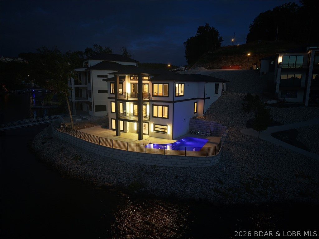 439 Red Bud Road Lake Ozark, MO 65049 - Photo 86 of 98 Stunning twilight view showcasing the illuminated