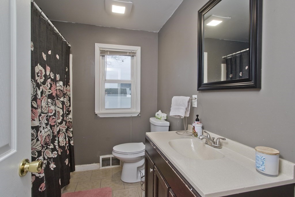 90 Spear Road Springfield, MA 01119 - Photo 11 of 19 a bathroom with a sink toilet and vanity