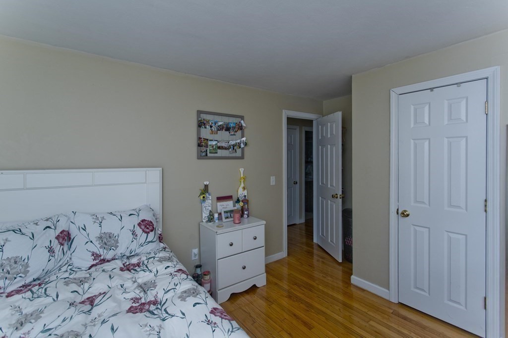 90 Spear Road Springfield, MA 01119 - Photo 13 of 19 a bedroom with a bed and wooden floor