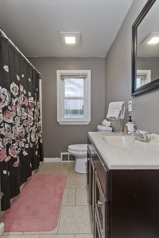 90 Spear Road Springfield, MA 01119 - Photo 15 of 19 a en suite bathroom with a sink vanity granite and toilet