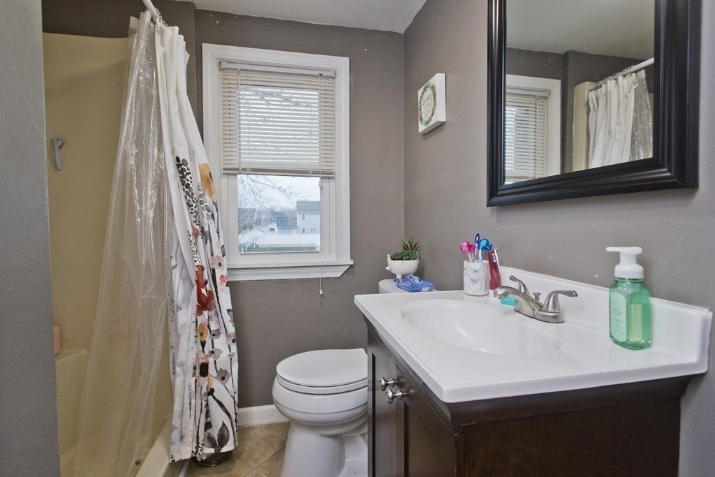 90 Spear Road Springfield, MA 01119 - Photo 17 of 19 a bathroom with a sink vanity and toilet