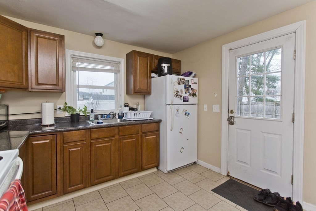 90 Spear Road Springfield, MA 01119 - Photo 5 of 19 a kitchen with refrigerator and window
