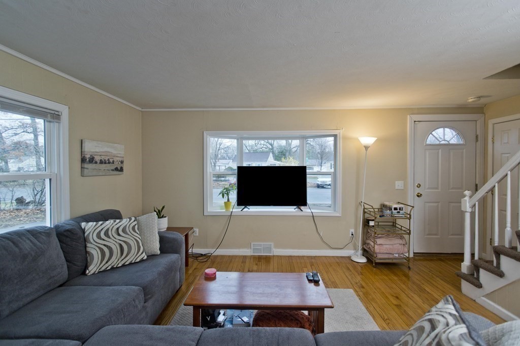 90 Spear Road Springfield, MA 01119 - Photo 10 of 19 a living room with furniture and a flat screen tv