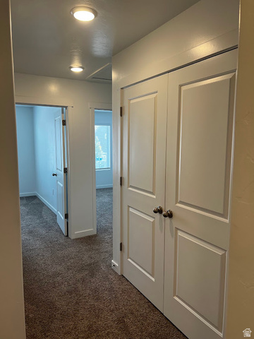 562 Hal Street, Unit 152 Tooele, UT 84074 - Photo 18 of 44 Hallway featuring recessed lighting, a neutral color palette, and carpeted flooring