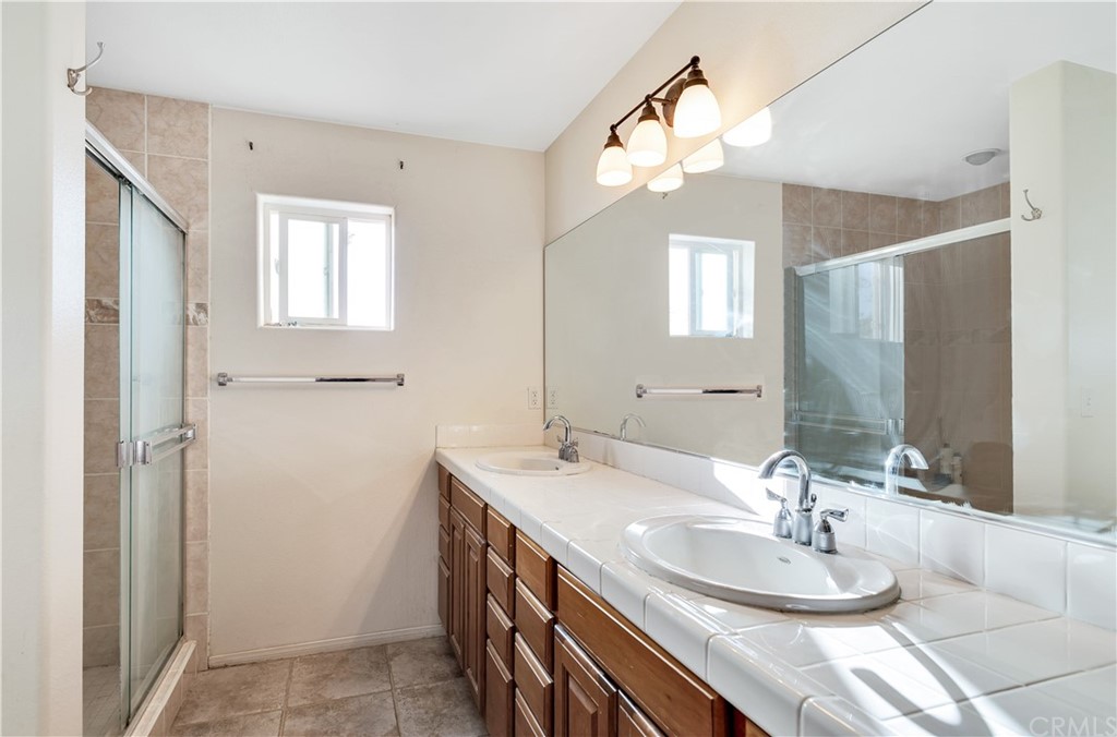 62401 Sunflower Road Joshua Tree, CA 92252 - Photo 18 of 75 a bathroom with a double vanity sink and a mirror