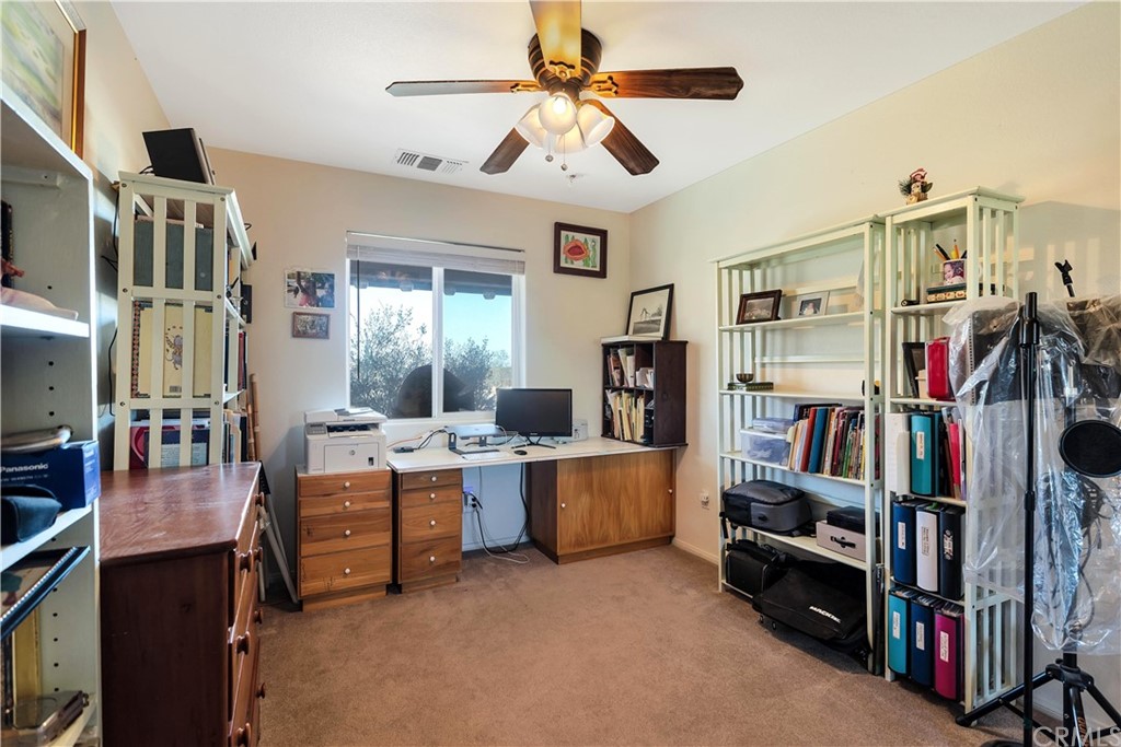 62401 Sunflower Road Joshua Tree, CA 92252 - Photo 22 of 75 a view of a livingroom with workspace and a window