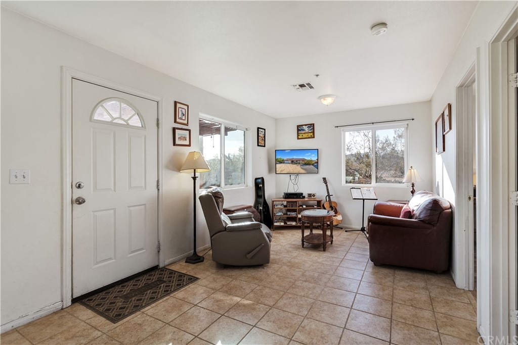 62401 Sunflower Road Joshua Tree, CA 92252 - Photo 31 of 75 a living room with furniture and a window