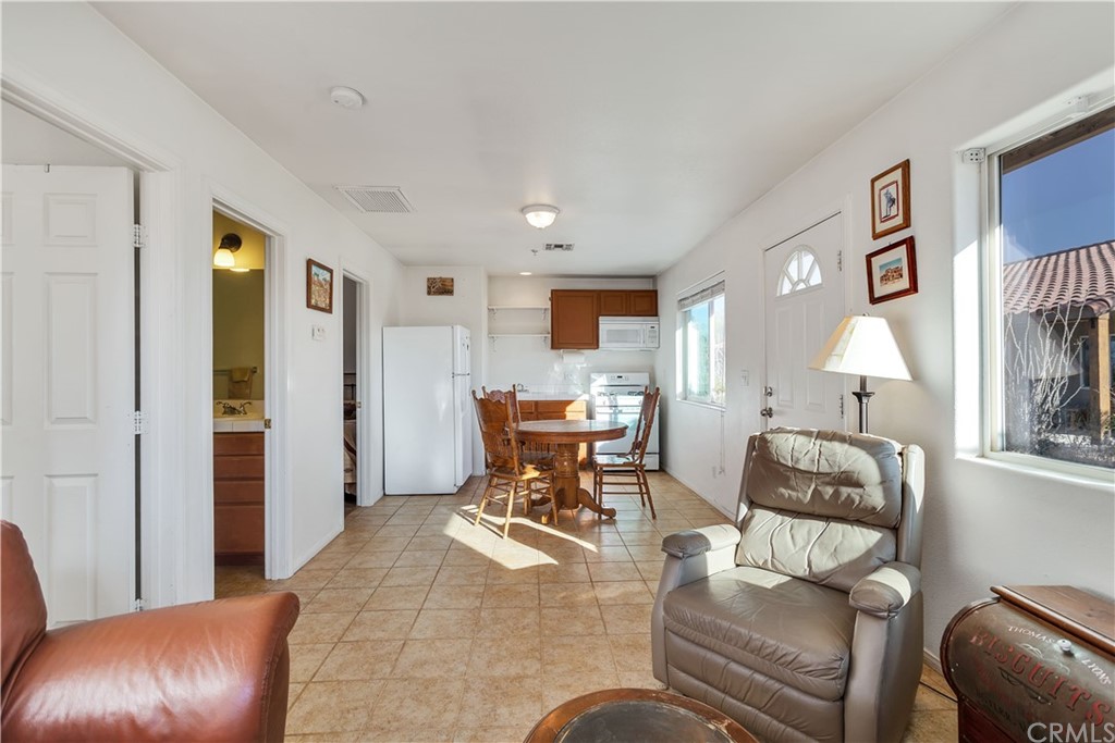 62401 Sunflower Road Joshua Tree, CA 92252 - Photo 35 of 75 a living room with furniture and a lamp