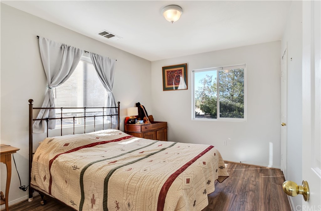 62401 Sunflower Road Joshua Tree, CA 92252 - Photo 38 of 75 a bedroom with a bed and a window