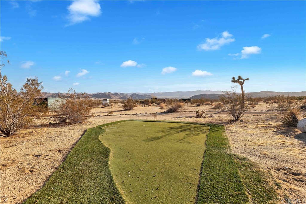62401 Sunflower Road Joshua Tree, CA 92252 - Photo 40 of 75 a view of a swimming pool and an ocean view