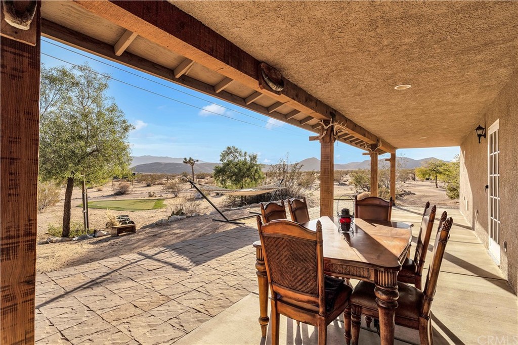 62401 Sunflower Road Joshua Tree, CA 92252 - Photo 42 of 75 a view of yard from deck with patio