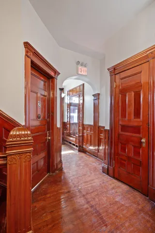 a view of entryway dining room and hall with wooden floor