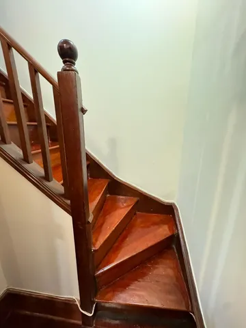 a kitchen with a wooden floor and a stove top oven