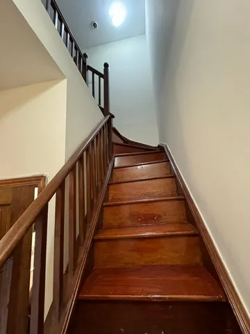 a bathroom with a sink a toilet a mirror and tub