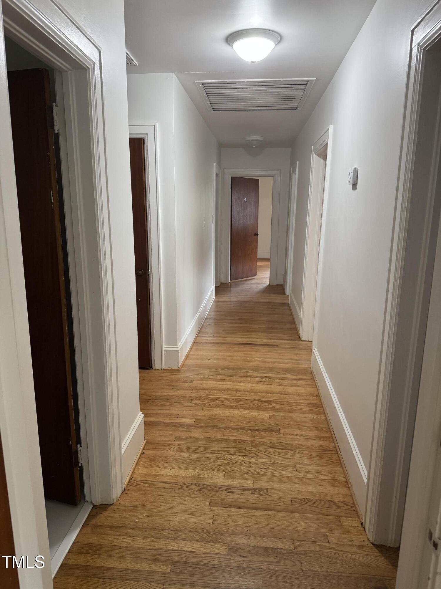 324 Bank Street Roper, NC 27970 - Photo 15 of 21 a view of a hallway with wooden floor