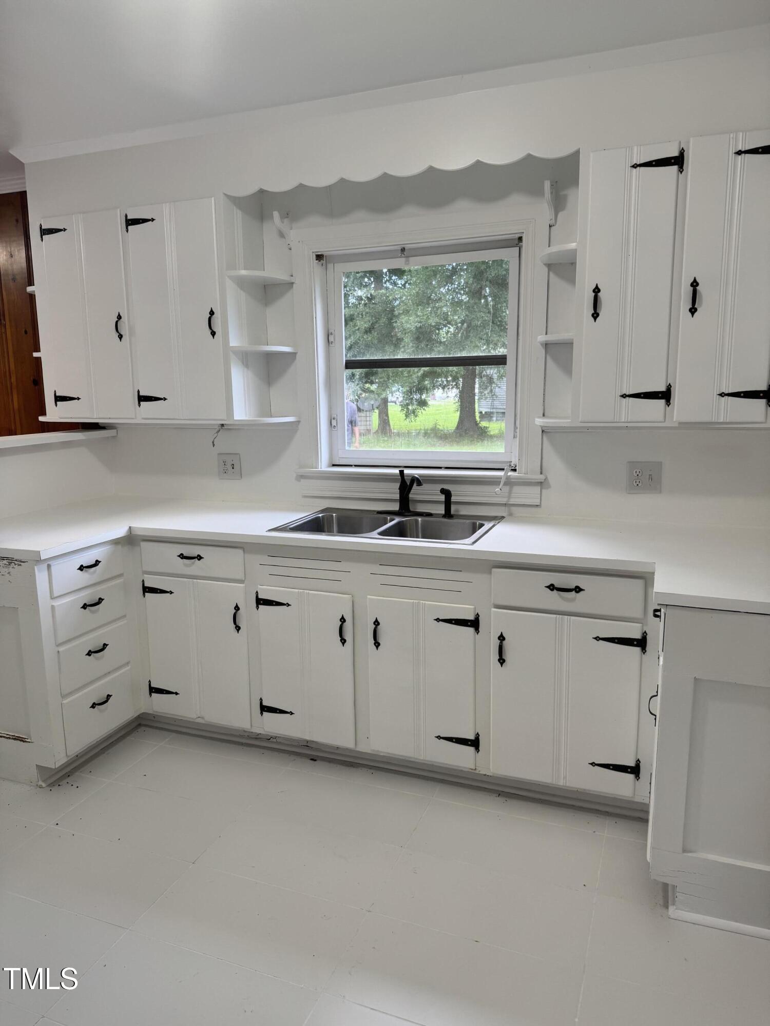 324 Bank Street Roper, NC 27970 - Photo 7 of 21 a kitchen with white cabinets white stainless steel appliances and a sink