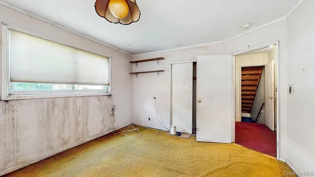 a view of room with wooden floor