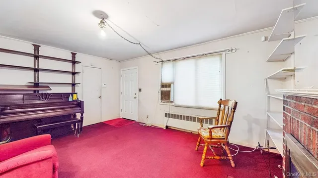 a livingroom with furniture and a piano