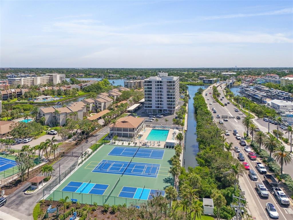 6415 Midnight Pass Road, Unit 211 Sarasota, FL 34242 - Photo 2 of 58 an aerial view of multiple house