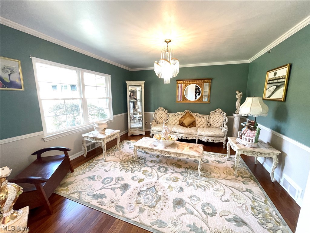 1507 Clubside Road Lyndhurst, OH 44124 - Photo 4 of 32 Living room featuring hardwood flooring and ornamental molding
