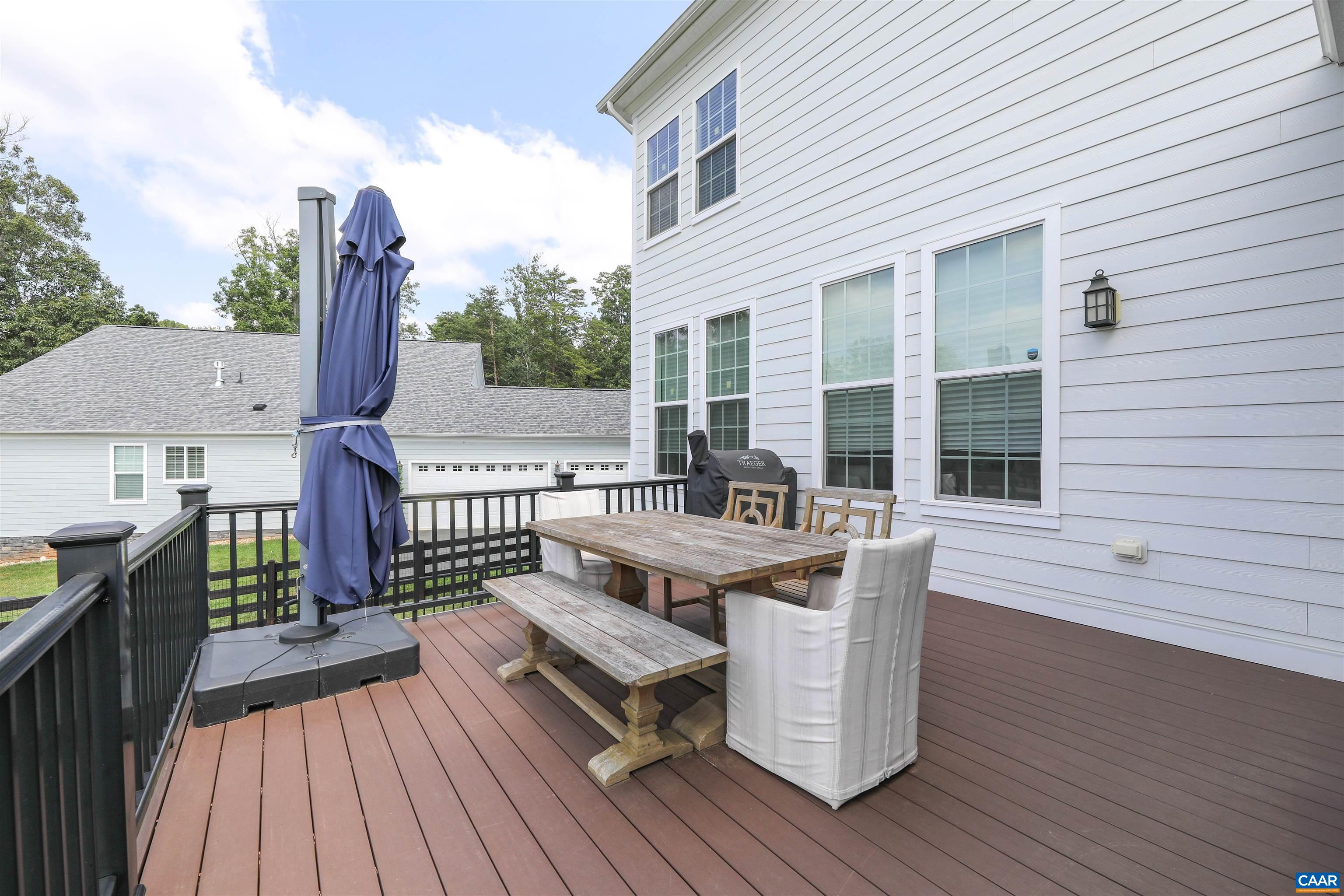 2483 Ferndown Lane Keswick, VA 22947 - Photo 46 of 54 a view of a deck with two chair and wooden floor