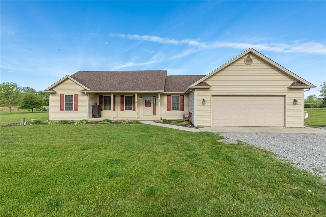 2645 Vance Road St. Paris, OH 43072 - Photo 2 of 35 This appealing residence features a welcoming facade with a covered entry and attached garage.