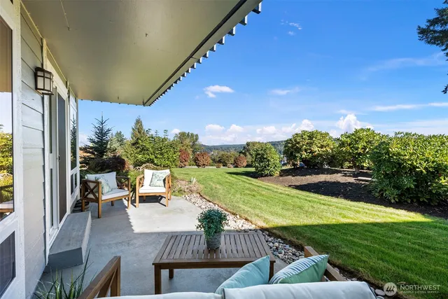 a bathroom with a double vanity sink mirror and shower
