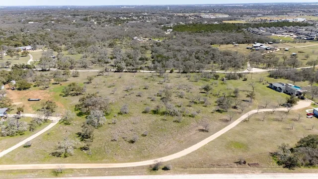 a view of a swimming pool with a yard