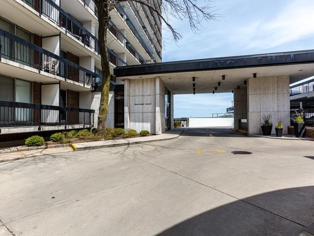 5901 North Sheridan Road, Unit 6G Chicago, IL 60660 - Photo 2 of 24 a view of a building with a garage